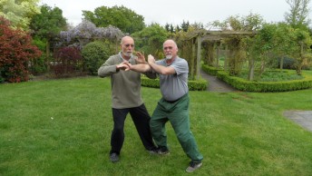 Ian Deavin and Karel Koskuba push hands